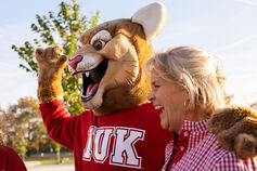 IU Kokomo mascot posing with a fan.
